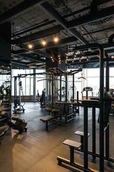 an empty gym with lots of exercise equipment