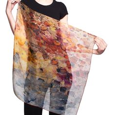 This exquisite 26x26" silk chiffon scarf, featuring the original artwork of Reed Slater, is a true work of art. Reed’s unique process involves carefully arranging tea bags and their drips on watercolor paper, which is then photographed, digitized, and transferred onto the silk. The result is a scarf with rich, vibrant colors that will not fade, making it a perfect gift for someone special. Features: Complimentary Shipping on all orders. Rare Earth Scarf: A stunning 26x26” design in gold and rust Handmade Silk Scarf, Elegant Multicolor Silk Scarf, Watercolor Scarf, Elegant Hand-dyed Silk Scarf Gift, Luxury Multicolor Artsy Silk Scarf, Silk Chiffon Scarves, Bohemian Hand-dyed Multicolor Silk Scarf, Elegant Hand-dyed Multicolor Silk Scarf, Small Scarf