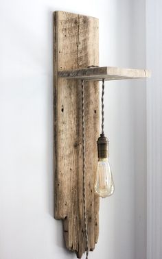 This easy and inexpensive modern rustic DIY light sconce brings nature and sustainability into decorating. Here are the DIY instructions. Wood Plank Walls, Diy Light Fixtures, Diy Barn, Diy Lampe, Home Simple, Plank Walls, Wooden Light, Barn Board, Simple Home