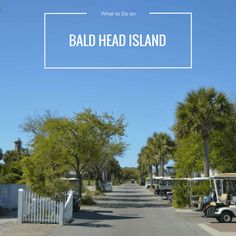 a golf cart driving down a street next to palm trees