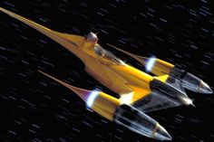 a yellow and black fighter jet flying through the night sky with stars in the background