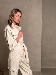 Brave the crisp air of winter's chill in this beautiful utility jumpsuit that takes flight in sumptuous, suede-like moleskin —made with cotton and a kiss of stretch— adorned with a cinched waist and full blouson sleeves to add to the effect of so Beige Cotton Jumpsuits And Rompers For Fall, Utility Overalls And Rompers For Fall, Utility Style Jumpsuits And Rompers For Fall, Fall Utility Jumpsuits And Rompers With Relaxed Fit, Winter Cotton Jumpsuits And Rompers For Work, Fall Workwear Belted Jumpsuits And Rompers, Beige Overall Jumpsuit For Fall, Utility Style Solid Color Jumpsuits And Rompers For Fall, Cotton Jumpsuits And Rompers For Winter Workwear