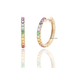 Rainbow sapphire hoop earrings gold | Natural rainbow huggies small earring gold | Rainbow ombre earrings gold | Rainbow sapphire hoops gold EARRING DETAILS : ✦ Earring Diametre : 20MM ✦ Earring Style : Hoops STONE DETAILS : ✦ Stone : Rainbow Sapphire, Amethyst, Garnet, Tanzanite, Topaz, Tourmaline, Peridot ✦ Stone Type : Natural ✦ Stone Size : 2MM ✦ Stone Shape : Round cut ✦ Number of stones : 18 ✦ Stone Weight : 0.50 carats ✦ Stone Grade : AAA METAL DETAILS : ✦ Metal : Solid 14K / 18K Gold ✦ M Multicolor Fine Jewelry Hoop Earrings As Gift, Elegant Rainbow Hoop Jewelry, Elegant Rainbow Colored Hoop Jewelry, Fine Jewelry Small Hoop Gemstone Earrings, Fine Jewelry Multicolor Hoop Earrings, Dainty Gemstone Huggie Earrings In Small Hoop, Fine Jewelry Multicolor Hoop, Multicolor Hoop Fine Jewelry, Everyday Rainbow Round Jewelry