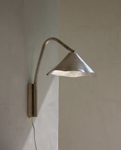 a lamp that is on the side of a wall