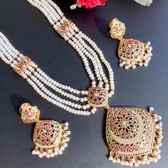 Featuring a traditional jadau haar in gold plated silver embellished with freshwater pearls and synthetic rubies and emeralds. 22k Gold Jewelry Necklaces, 22k Gold Jewelry, Pearl Necklace Set, Gold Jewelry Necklace, Emerald Necklace, Gold Bangle Bracelet, Gold Plated Silver, 22k Gold, Pendant Set