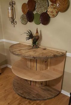 a wooden table sitting in the corner of a room