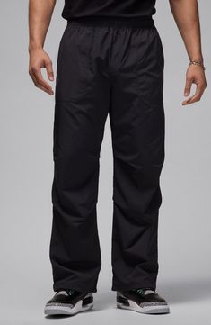 Roomy and relaxed, these all-activity pants made of lightweight nylon sport a trio of handy pockets and a go-anywhere-do-anything vibe. Elastic waist Front slant pockets; back welt pocket 100% nylon Machine wash, line dry Imported Athleisure Hiking Pants With Functional Pockets, Functional Black Nylon Bottoms, Athleisure Pants With Functional Pockets For Hiking, Moisture-wicking Nylon Techwear Bottoms, Black Functional Nylon Bottoms, Nylon Hiking Bottoms With Cargo Pockets, Black Nylon Parachute Pants With Functional Pockets, Sporty Hiking Pants With Functional Pockets, Waterproof Nylon Athleisure Bottoms