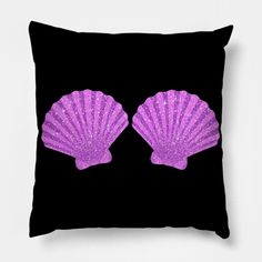 two purple seashells on a black background with glitter in the shape of hearts