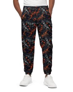 Front view of model wearing One Stop Rave's T-Wrecked Unisex Track Pants, showing off the dynamic dinosaur print. Sitting Design, Lost Lands Festival, Lost Lands, Sustainable Shopping, Dubstep, Ankle Cuffs, Dinosaur Print, Track Pants, Snug Fit