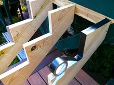 a close up of a light on a wooden deck