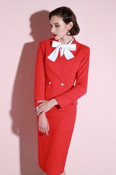 The Ensemble Marielle is a stylish and chic two-piece suit for the intellectual woman. Featuring a pinch fold at the waist and two large pearl buttons, this suit highlights your waist line with finesse. The flower bud type silhouette gives off a feminine air while the knee-length cut gives a classic, elegant appeal. Experience fashion and sophistication with the Ensemble Marielle. Chic Red Semi-formal Suit, Elegant Semi-formal Pantsuit With Buttons, Elegant Single-breasted Skirt Suit For Formal Occasions, Elegant Red Spring Suit, Chic Red Formal Suit, Elegant Formal Skirt Suit With Single Button, Elegant Formal Pantsuit With Buttons, Chic Red Suit For Formal Occasions, Elegant Semi-formal Single-breasted Skirt Suit