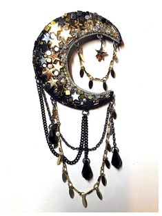 Handcrafted brooch made from: - glass and crystal beads in shades of gold, silver and black - includes Swarovski Crystal drops, and gold-plated and black hematite stars - revolver bar brooch metal fastening to back Dimensions: - moon: 5.5cm x 5cm (LxW) - moon plus chain: 11cm x 5cm (LxW) Black Metal Brooch Jewelry, Black Brooch Pins For Party, Black Party Brooch Pins, Black Brooch Jewelry For Party, Black Party Jewelry Brooch, Moon Beads, Stars Gold, Bead Hair Accessories, Bar Brooch