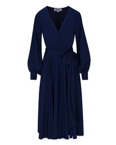 This 70's inspired midi dress features a sexy cross front V-shaped surplice neckline. The elasticized waist adjusts to fit a range of sizes and has an attached self-tying belt at the right-hand side seam. The cuffed bell sleeves add a hint of retro glamour. The opaque fabric has a butter-soft hand with a beautiful navy blue hue. The full, sweeping circle mid-length skirt is perfect for making a dramatic entrance to any event. The skirt is partially lined. DetailsBrand: Meghan LAColor: NavyLength Dramatic Entrance, Retro Glamour, Deep Navy Blue, Fashion District, Surplice Neckline, Navy Midi Dress, Medium Dress, Mid Length Skirts, 70s Inspired