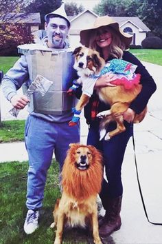 two people and their dogs are dressed up for halloween