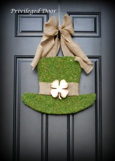 a st patrick's day door hanger with a shamrock hat