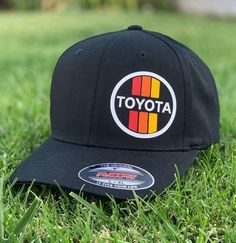 These Vintage Toyota flex-fit hats are hand-made using high quality thermal vinyl material and are designed to perfectly compliment our Vintage Toyota tee-shirts and sweatshirts. Available with a black or charcoal grey hat. These are hand-made to order, so all sales are final. Black Trucker Fitted Hat For Baseball Season, Adjustable Black Dad Hat, Black Hat With Custom Logo For Streetwear, Custom Logo Black Baseball Cap, One Size, Black Baseball Cap With Custom Logo For Baseball Season, Black Hat With Custom Logo For Baseball Season, Black Hats With Custom Logo For Sports Events, Black Hats With Custom Logo And Curved Brim, Black Fitted Hat With Curved Bill For Baseball Season