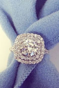 an image of a diamond ring on top of a blue cloth with the words bridal jewelry