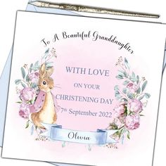 a greeting card with an image of a bunny and flowers