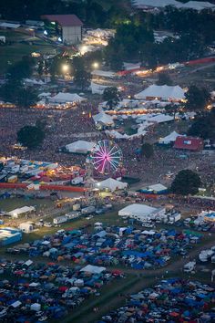 an aerial view of a festival with tents and fireworks