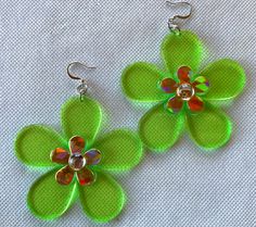 Made from Vintage plastic parts from the early 1970'S .   Lime green plastic Daisy with another smaller plastic Daisy on top.  A Crystal cabochon stone in center.   Fishhook closure silver finish. Measures 2-1/2 inches long and 2-3/4 inches wide.  Item may have slight blemishes as these pieces are old. I picked out the best pieces to make these earrings.  Very Mod and right from the 70'S .  Made in USA. Retro Multicolor Flower Earrings For Gift, Cheap Retro Flower Earrings, Retro Spring Flower Earrings, 60s Flower Earrings, Cheap Playful Flower-shaped Earrings, Fire Earrings, Celebrity Jewelry, Daisy Earrings, School Themes