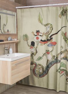 a bathroom with a dragon shower curtain next to a white sink and wooden counter top