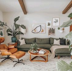 a living room filled with furniture and plants