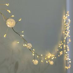 a string of lights hanging from the side of a wall