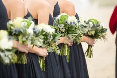 the bridesmaids are holding their bouquets with green and white flowers on them