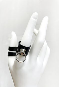 LIMITED EDITION Handmade in deadstock patent leather, these rings are the perfect high-shine accessory to catch the eye. Each ring featured a tiny silver O-ring, and is secured with a single gunmetal rivet around the back. For custom sizing, please contact hello@shoptrued.com. Punk Leather Jewelry With Wrist Strap, Adjustable Black Punk Style Rings, Black Punk Leather Bracelet Fashion Accessory, Black Leather Ring, Punk Style Adjustable Black Ring, Spiked O Ring Choker, Punk Leather Wrist Strap Jewelry, Tablet Accessories, Fragrance Gift Set