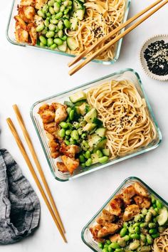 three glass dishes filled with food and chopsticks