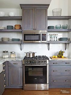 a stove top oven sitting inside of a kitchen