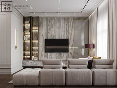 a modern living room with white couches and marble walls