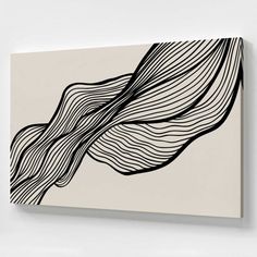 a black and white painting hanging on the wall