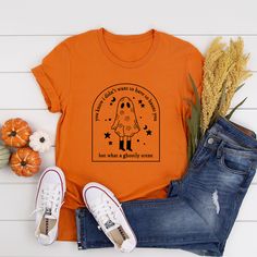 an orange t - shirt with a cartoon character on it