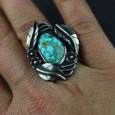 Named after my great grandmother, the Flora rings will always hold a special place in my heart. She had a prolific garden with flowers, trees, climbing vines, and LOTS of birds. The FLORA RING is a celebration of Mother Nature and all the beauty she creates. This one of a kind STERLING SILVER ring features an incredible PILOT MOUNTAIN TURQUOISE stone that was ethically mined in Nevada. I make each leaf and flower with my own two hands, and the hand crafted double ring shank is both comfortable a Untreated Nature-inspired Rings For Anniversary, Nature-inspired Untreated Rings For Anniversary, Unique Flower Ring For Anniversary, Nature-inspired Untreated Rings For Wedding, Nature-inspired Untreated Wedding Rings, Unique Handmade Flower Ring For Anniversary, Heirloom Handmade Turquoise Ring For Anniversary, Handmade Heirloom Turquoise Ring For Anniversary, Handmade Fine Jewelry Turquoise Anniversary Ring