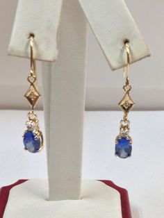 SOLID 14KT YELLOW GOLD DANGLE EARRINGS NATURAL SAPPHIRE IS  5x7 mm OVAL SHAPE EACH  BLUE DIFFUSION-TREATED SAPPHIRE NATURAL DIAMOND IS 0.04 TCW EARRING LENGTH IS  1.50" INCHES WITH GIFT BOX Gold Dangle Earrings, Sapphire Earrings, Gold Earrings Dangle, Natural Sapphire, Oval Shape, Favorite Jewelry, Jewelry Earrings Dangle, Natural Diamonds, Diamond Earrings