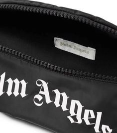 Primed for the everyday, this Palm Angels Kids belt bag features a zipped top and adjustable strap for the perfect fit. This piece features the brand's logo lettering in a distinctive gothic typeface..Material: fabric.Internal details: fabric lining.Designer color name: Black White.Closure: zipped top.Adjustable belt strap.Made in Italy.Comes with dust bag.Height 11cm-4.5'.Width 23cm-9'.Depth 5,5cm-2'.Min. strap length 32cm-12.5'.Max. strap length 75cm-29.5'.Strap width 3,5cm-1.5' Trendy Black Bags With Logo Print, Black Travel Bag With Logo Tag, Black Bag With Logo Tag For Travel, Functional Black Bag With Logo Print, Streetwear Nylon Bag With Logo Patch, Palm Angels Hat, Palm Angels Bag, Palm Angels Bucket Hat, Palm Angels Crop Top