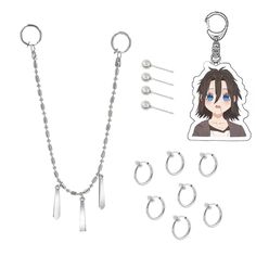 an assortment of metal items including a chain, earring and keychain with a sticker on it