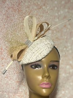 Cream Button Fascinator Half Hat for Church Head Covering, Tea Party, Wedding, and Other Special Occasions This cream circular hat is trimmed with veil and sinamay bows. Beautiful show-stopper! Mannequin is wearing size 6 inches. Available in 3 sizes  6 inches diameter 7 inches  8 inches  Hat affixes to head by hat string. Handmade gifts for mom, sister, wife, or yourself. Love what you see, but would like it in a different color, shape or size? Please contact us by sending a message. We offer custom hats in a variety of styles. PLEASE NOTE All items for Free Shipping will be shipped via USPS First Class Mail. Party Bridal Hat Accessories, Fitted Cream Costume Hats And Headpieces For Ceremony, Elegant Mini Party Hats With Pinched Crown, Gold Gatsby Style Formal Headpieces, Elegant Fitted Bridal Accessories For Party, Vintage Wedding Costume Hat With Pinched Crown, Elegant Fascinator With Structured Crown For Church, Elegant Mini Headband Hat For Kentucky Derby, Elegant Vintage Hat Headpieces