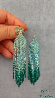 These handmade earrings are made of high-quality Czech beads and strong synthetic thread. They are elegant, fashionable, and highly versatile, suitable for everyday wear. Color: turquoise, emerald, teal . 100% hand made with love! Measurements: Length-about 11.5cm (4.33 inch) Width -about 2 cm (0.79 inch) Materials: Sterling silver components Czech glass beads Nylon Thread Turquoise Jewelry With Tassels And Round Beads, Beaded Fringe Dangle Jewelry For Beach, Beach Dangle Jewelry With Beaded Fringe, Green Tassel Jewelry For Summer, Summer Green Tassel Jewelry, Green Bohemian Long Drop Earrings, Handmade Green Tassel Earrings For Beach, Green Beaded Long Drop Jewelry, Green Beaded Fringe Jewelry For Summer