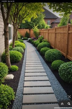 a long narrow garden path in front of a house