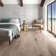 a bedroom with wood floors and white walls