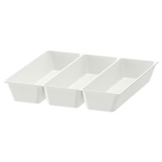 three white dishes sitting on top of each other