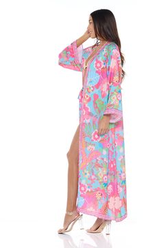 Go from beach to boardwalk in a flowery border-print cover-up wrap with a front-tie closure for easy layering. 54" length Shawl collar Long sleeves 100% polyester Hand wash, dry flat Imported Spring Beach Party Cover-up With Tie Waist, Spring V-neck Swimwear With Tie Waist, Multicolor Printed Wrap Cover-up, Pink Kimono For Beach Cover-up During Beach Season, Pink Kimono For Beach Cover-up, Blue Floral Print Beach Robe, Spring V-neck Pool Cover-up, Spring Wrap Robe For Beach Cover-up, Spring Pink Swimwear With Vibrant Print