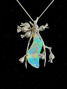 This beautiful Coober Crystal Opal is 15 CT's and has been set in a handcrafted sterling silver setting with sterling silver chain, to represent an Australian gum leaf.  It is truely a statement piece. Artisan Carved Sterling Silver Jewelry, Sterling Silver Soldered Jewelry For Weddings, Iridescent Sterling Silver Spiritual Jewelry, Sterling Silver Carved Pendant Jewelry, Carved Sterling Silver Pendant Jewelry, Silver Nature-inspired Jewelry, Artisan Silver Opal Jewelry, Iridescent Sterling Silver Wedding Jewelry, Collectible Silver Necklace Nature-inspired