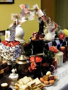 a table topped with lots of different types of cakes and desserts on top of it