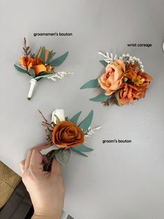 someone is arranging flowers on the wall to decorate their home or office area with them