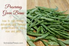 green beans sitting on top of a wooden cutting board