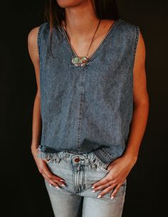 All-over denim isn’t just for tuxedoes with the Wrangler® denim frayed tank. This denim darling comes with our signature stitching down the front and sides, with a zipper down the back for that classic denim look. Made from 100% cotton, this top brings our most durable and comfortable denim on top for a feel that forms to your body, just like your favorite Wrangler jeans. Plus, its frayed edges add a unique definition to your waist for a textured element on any outfit. Medium Wash Denim Cutoff Tops, Dark Wash Denim Top With Frayed Hem, Denim Blue Denim Vest With Frayed Hem, Dark Wash Denim Vest With Frayed Hem, Summer Cutoff Medium Wash Denim Top, Summer Cutoff Denim Top In Medium Wash, Denim Cutoff Tops With Frayed Hem, Medium Wash Denim Vest With Frayed Hem, Light Wash Denim Vest With Frayed Hem For Summer