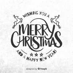 merry christmas and a happy new year handwritten lettering on white paper with black ink